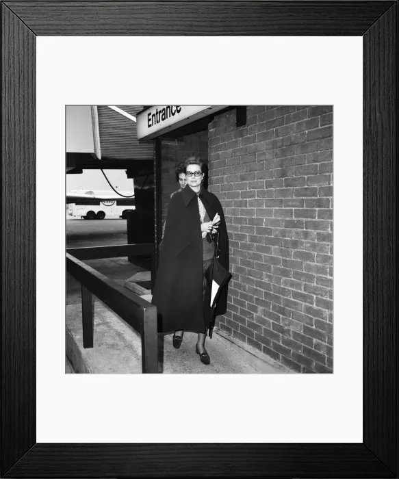 Framed Print : Princess Grace of Monaco, wearing a full length cape, as she arrives at Heathrow Airport