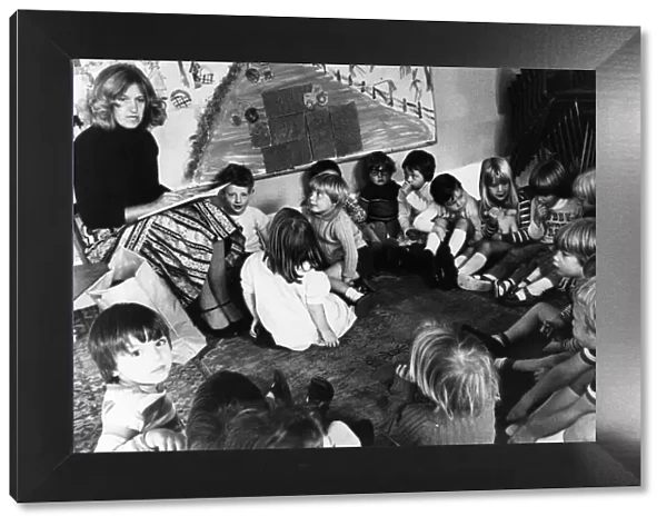 Jennifer Whyte reads the youngsters a story in a Cambridge Nursery, September 1978