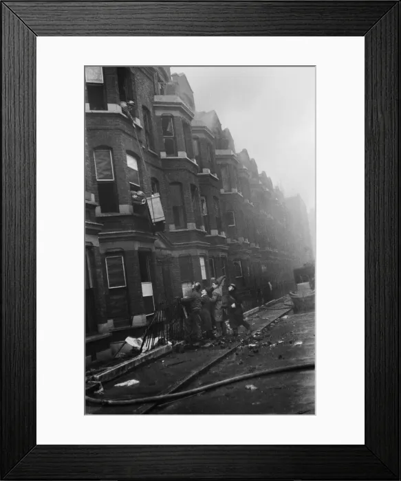 Framed Print : Fire crews, police and ARP wardens help salvage furniture from properties close to