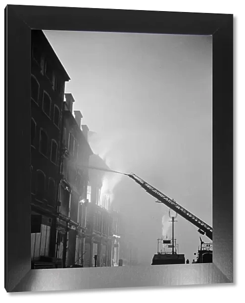 A turntable ladder of the London Fire Brigade tackles fires on Aldersgate Street
