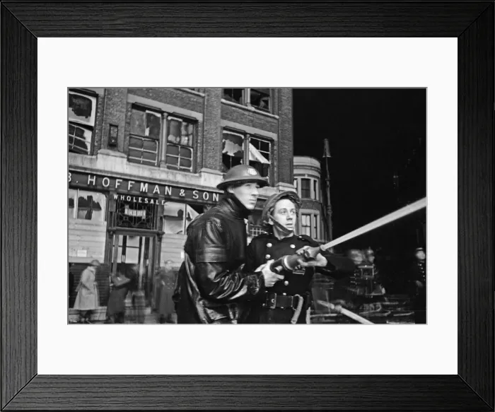 Framed Print : Members of the Auxiliary Fire Service and London Fire Brigade seen here fighting a fire
