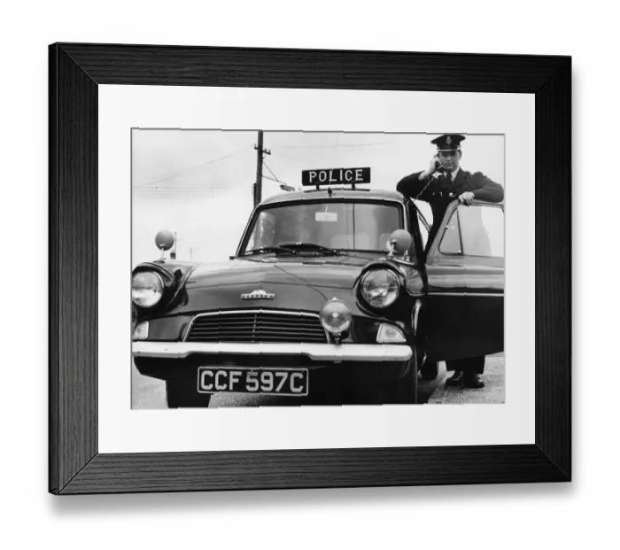 Framed Print : A Cambridgeshire police officer driving a Ford Anglia police car at Mildenhall Framed Print : A Cambridgeshire police officer driving a Ford Anglia police car at Mildenhall