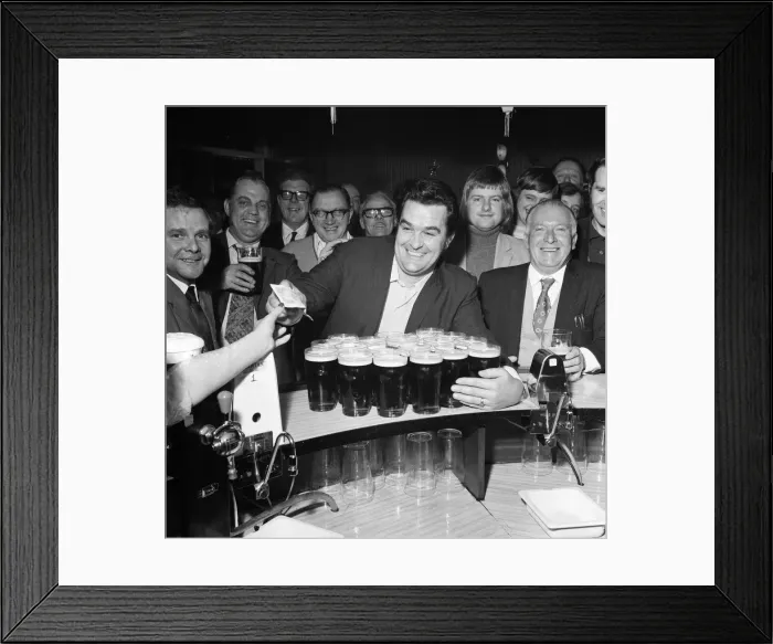Framed Print : A drinkers dream - man with twenty pints in the pub. 1st January 1973 Framed Print : A drinkers dream - man with twenty pints in the pub. 1st January 1973