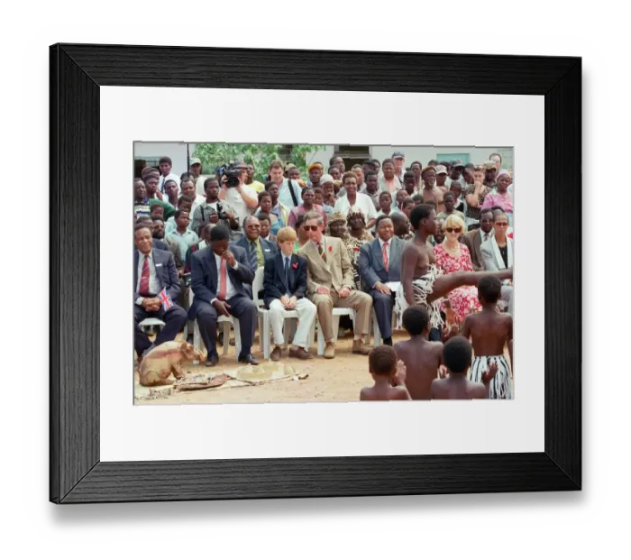 Framed Print : Prince Charles and his son Prince Harry watching dancers while on their visit to Framed Print : Prince Charles and his son Prince Harry watching dancers while on their visit to