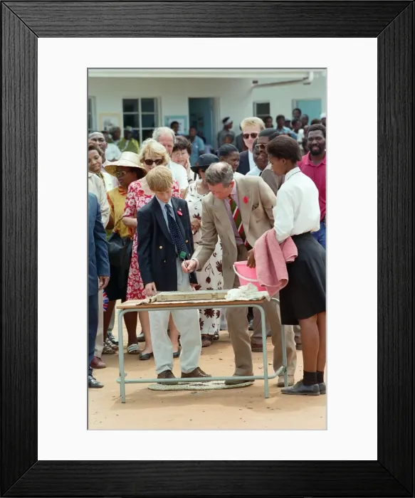 Framed Print : Prince Charles and his son Prince Harry visit the village of Dukuduku in South Africa Framed Print : Prince Charles and his son Prince Harry visit the village of Dukuduku in South Africa
