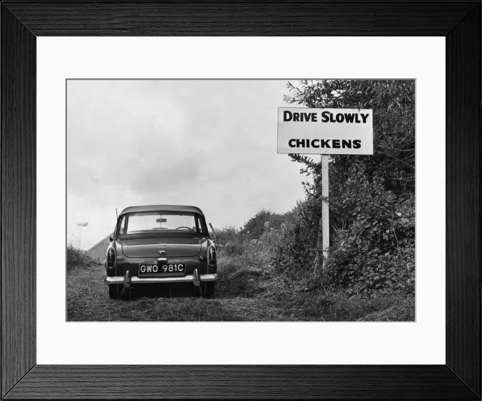 Framed Print : A sign warning motorists leaving the Monmouthshire show that they will drive through a