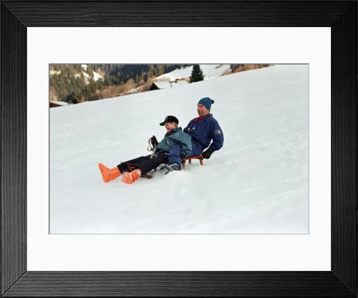Framed Print : Prince Charles on a sledge with Prince Harry while on holiday in Klosters, Switzerland