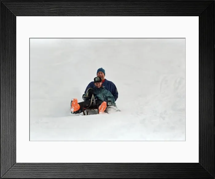 Framed Print : Prince Charles on a sledge with Prince Harry while on holiday in Klosters, Switzerland Framed Print : Prince Charles on a sledge with Prince Harry while on holiday in Klosters, Switzerland