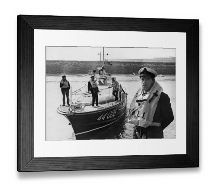 Framed Print : Coxswain Frank Tinsley stands in from of the Barry lifeboat RNLB Arthur Framed Print : Coxswain Frank Tinsley stands in from of the Barry lifeboat RNLB Arthur