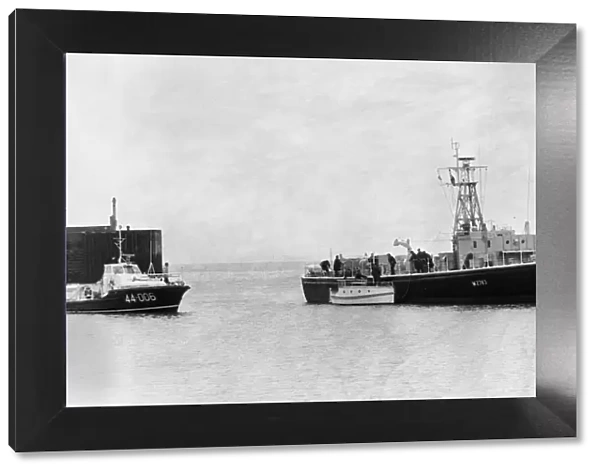 The Barry lifeboat and the Royal Navy Auxiliary ship Odiman escorts the small craft