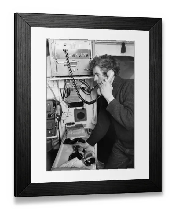 Framed Print : John Hart receives a message on the ship to shore lifeboat radio in Barry, Wales Framed Print : John Hart receives a message on the ship to shore lifeboat radio in Barry, Wales