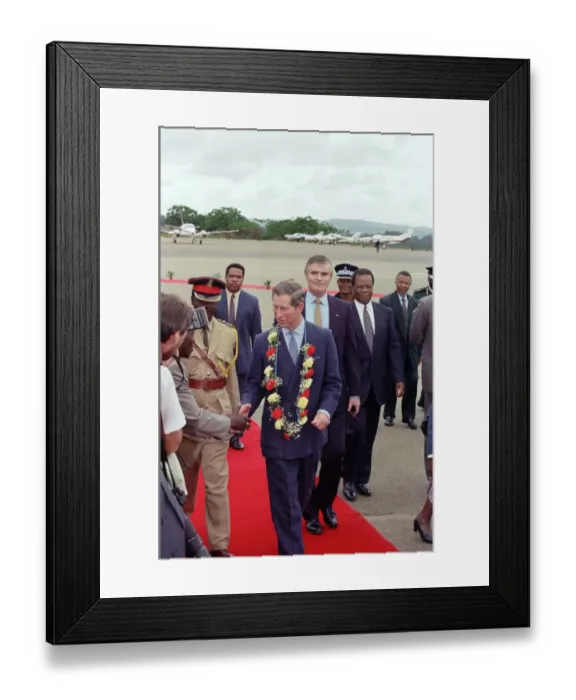 Framed Print : Charles, Prince of Wales, arrives in Swaziland, wearing a flower garland of carnations Framed Print : Charles, Prince of Wales, arrives in Swaziland, wearing a flower garland of carnations