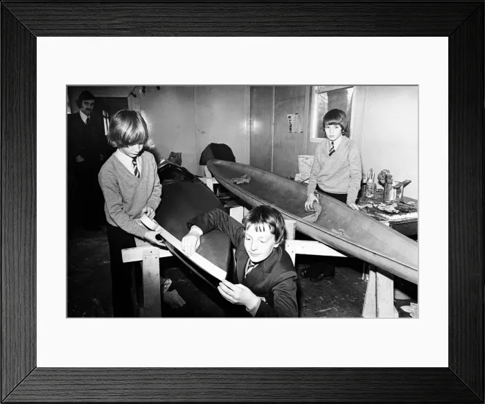 Framed Print : Children at Sarah Metcalfe School build a canoe in Wood shop class, Middlesbrough Framed Print : Children at Sarah Metcalfe School build a canoe in Wood shop class, Middlesbrough
