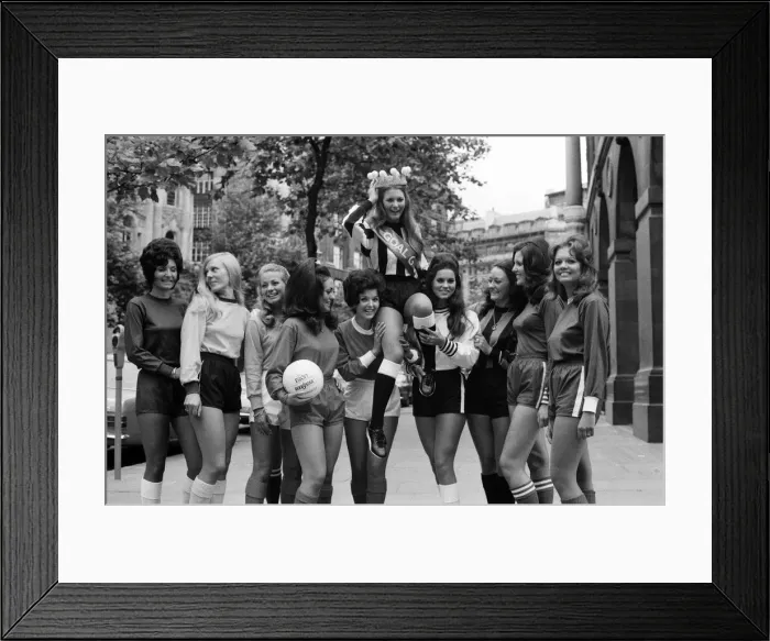 Framed Print : Eleven girls this morning lined-up dressed in the colours of their favourite football