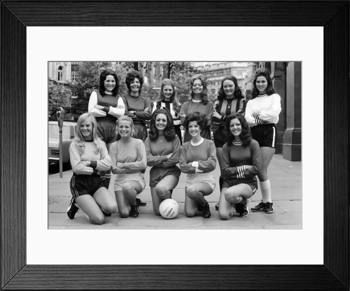 Framed Print : Eleven girls this morning lined-up dressed in the colours of their favourite football