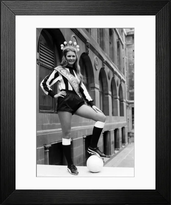 Framed Print : Eleven girls this morning lined-up dressed in the colours of their favourite football Framed Print : Eleven girls this morning lined-up dressed in the colours of their favourite football
