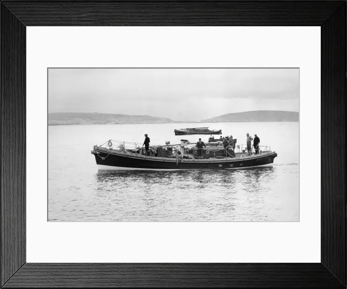 Framed Print : The new Mumbles lifeboat passes in front of the temporary one which replaced the SS