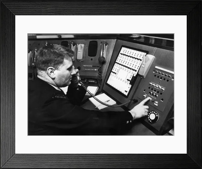 Framed Print : Fireman demonstrates new electronic private circuit system installed in Control Room Framed Print : Fireman demonstrates new electronic private circuit system installed in Control Room