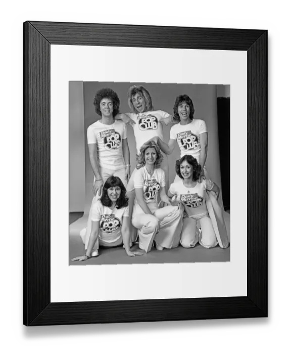 Framed Print : Guys N Dolls pop group wearing Daily Mirror Pop Club T-shirts 29th January 1976 Framed Print : Guys N Dolls pop group wearing Daily Mirror Pop Club T-shirts 29th January 1976
