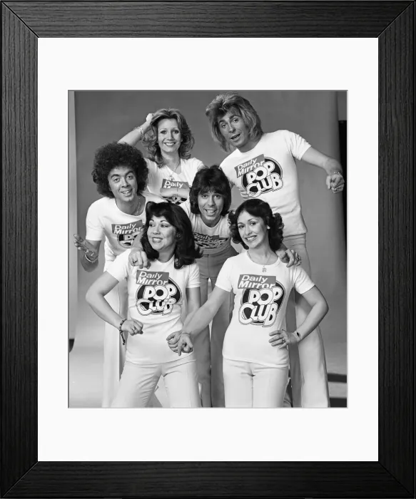 Framed Print : Guys N Dolls pop group wearing Daily Mirror Pop Club T-shirts 29th January 1976 Framed Print : Guys N Dolls pop group wearing Daily Mirror Pop Club T-shirts 29th January 1976
