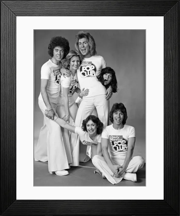 Framed Print : Guys N Dolls pop group wearing Daily Mirror Pop Club T-shirts 29th January 1976 Framed Print : Guys N Dolls pop group wearing Daily Mirror Pop Club T-shirts 29th January 1976