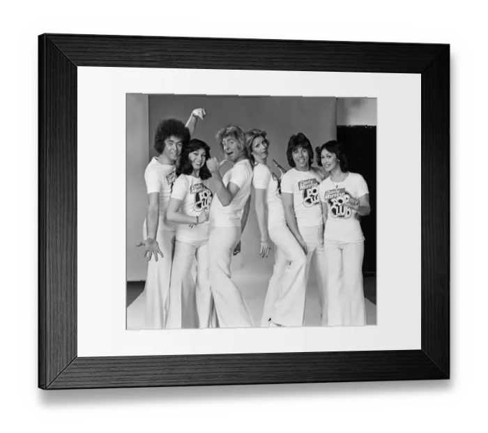 Framed Print : Guys N Dolls pop group wearing Daily Mirror Pop Club T-shirts 29th January 1976 Framed Print : Guys N Dolls pop group wearing Daily Mirror Pop Club T-shirts 29th January 1976