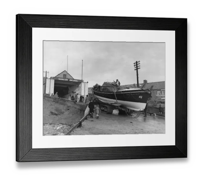 Framed Print : The Newbiggin lifeboat Richard Ashley being towed back into the Lifeboat House after Framed Print : The Newbiggin lifeboat Richard Ashley being towed back into the Lifeboat House after