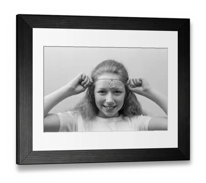 Framed Print : Lena Zavaroni wears a Daily Mirror Pop Club T-Shirt and a Daily Mirror Pop Club Pendant Framed Print : Lena Zavaroni wears a Daily Mirror Pop Club T-Shirt and a Daily Mirror Pop Club Pendant