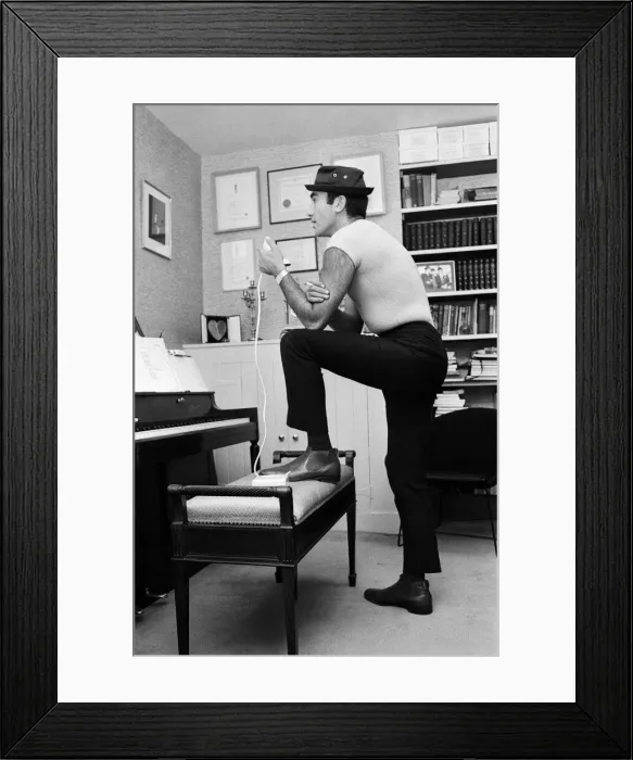 Framed Print : Songwriter and composer Lionel Bart in his flat in South Kensington Framed Print : Songwriter and composer Lionel Bart in his flat in South Kensington