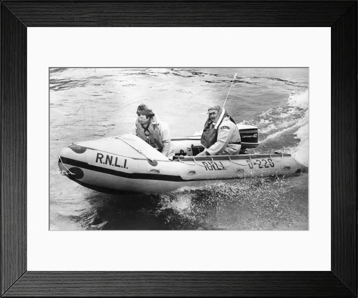 Framed Print : The RNLI lifeboat D. 228 takes to the sea for the first time in Craster harbour