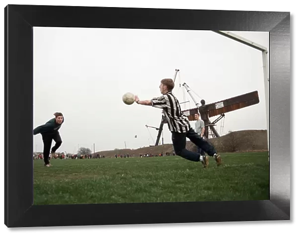 A football game takes place in front of the Angel of the North, Gateshead