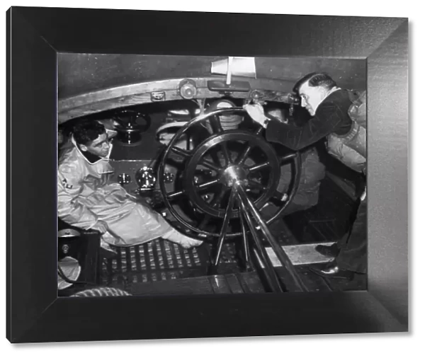 Andrew Mitchell (mechanic) chats with coxswain Gall in the wheelhouse of the Broughty