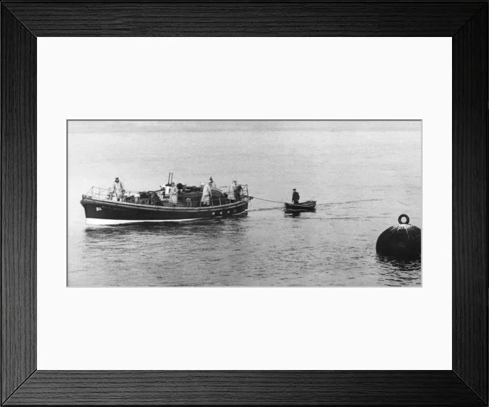 Framed Print : A fisherman is towed to safety by the Tynemouth lifeboat Framed Print : A fisherman is towed to safety by the Tynemouth lifeboat