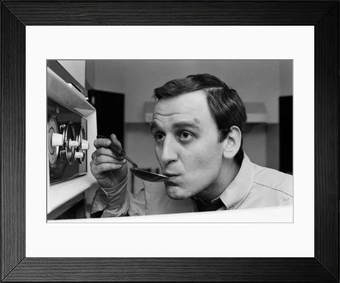 Framed Print : Actor John Thaw has been his own chef for many years. He checks the sauce from one his Framed Print : Actor John Thaw has been his own chef for many years. He checks the sauce from one his