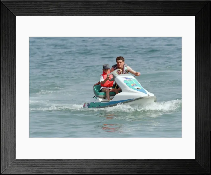 Framed Print : Prince Harry on a jet ski while on holiday in Marbella, Spain, July 1994 Framed Print : Prince Harry on a jet ski while on holiday in Marbella, Spain, July 1994