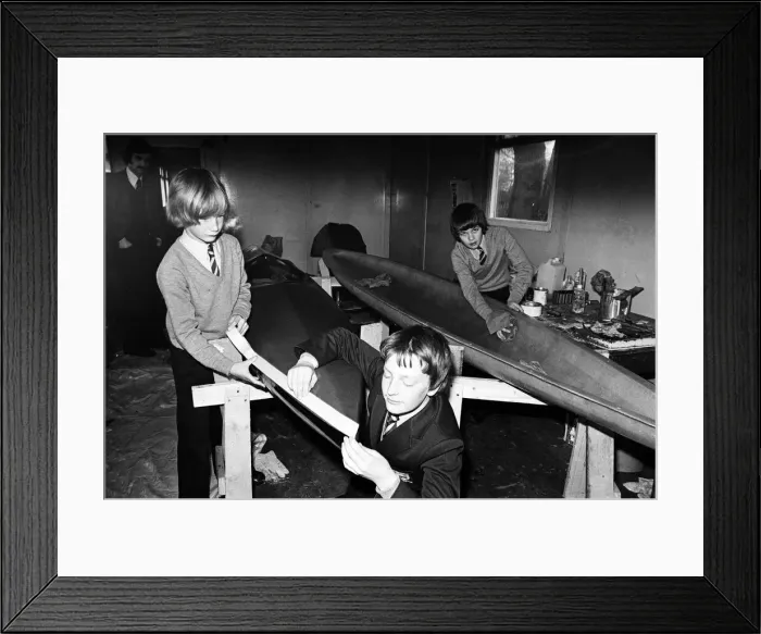 Framed Print : Children at Sarah Metcalfe School build a canoe in Wood shop class, Middlesbrough