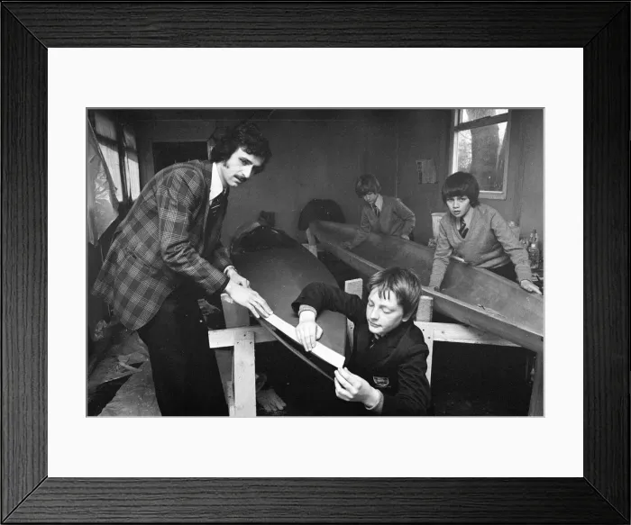 Framed Print : Children at Sarah Metcalfe School build a canoe in Wood shop class, Middlesbrough Framed Print : Children at Sarah Metcalfe School build a canoe in Wood shop class, Middlesbrough