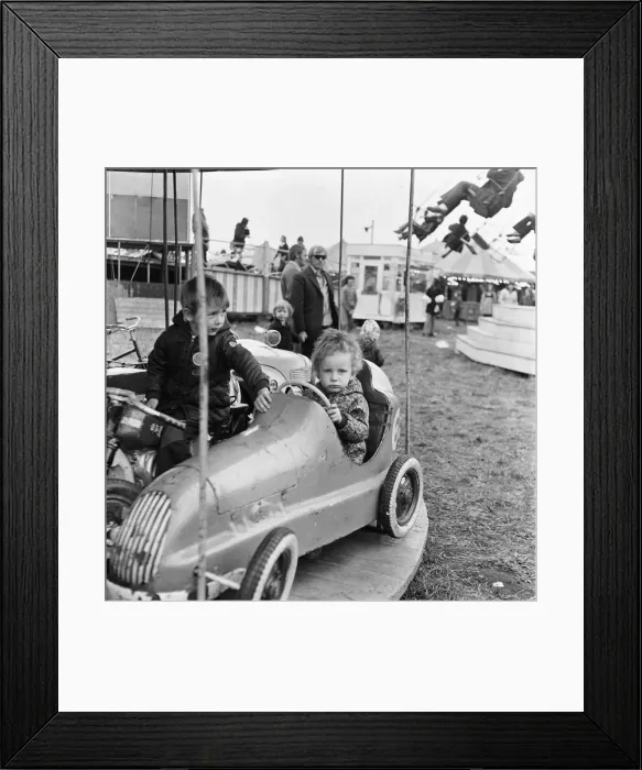 Framed Print : A small child enjoying the thrill of the merry-go-round at Silcocks Fair at Skelmersdale Framed Print : A small child enjoying the thrill of the merry-go-round at Silcocks Fair at Skelmersdale