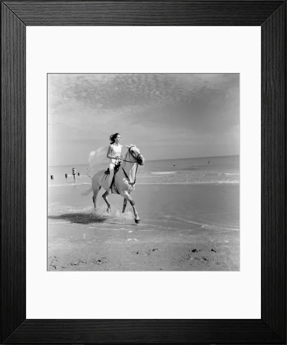 Framed Print : Diana Rigg, who plays Emma Peel, pictured riding a white horse across the beach at St Framed Print : Diana Rigg, who plays Emma Peel, pictured riding a white horse across the beach at St