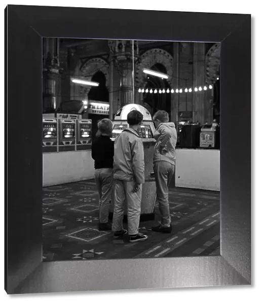 Three young boys pictured in the amusement arcades. Scarborough, North Yorkshire