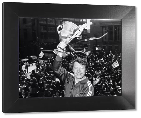 Alex Ferguson holding the Scottish league championship trophy after winning the Scottish