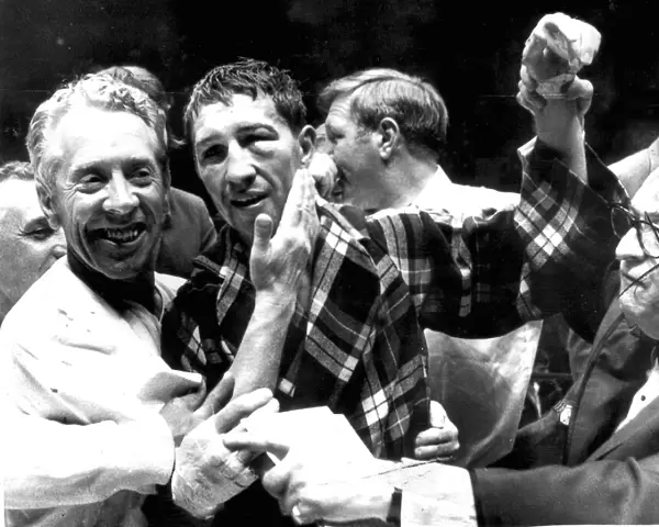 boxing 1970 LIGHTWEIGHT CHAMPION KEN BUCHANAN OF SCOTLAND GETS A PAT ON THE CHEEK FROM