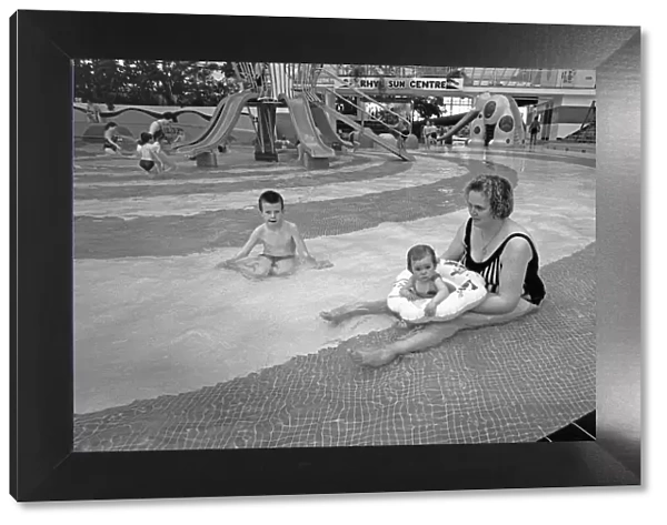 Mum and baby enjoy the shallow pool at The Suncentre, Rhyl