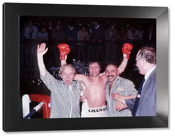 Ken Buchanan boxer arms raised after win with seconds in ring
