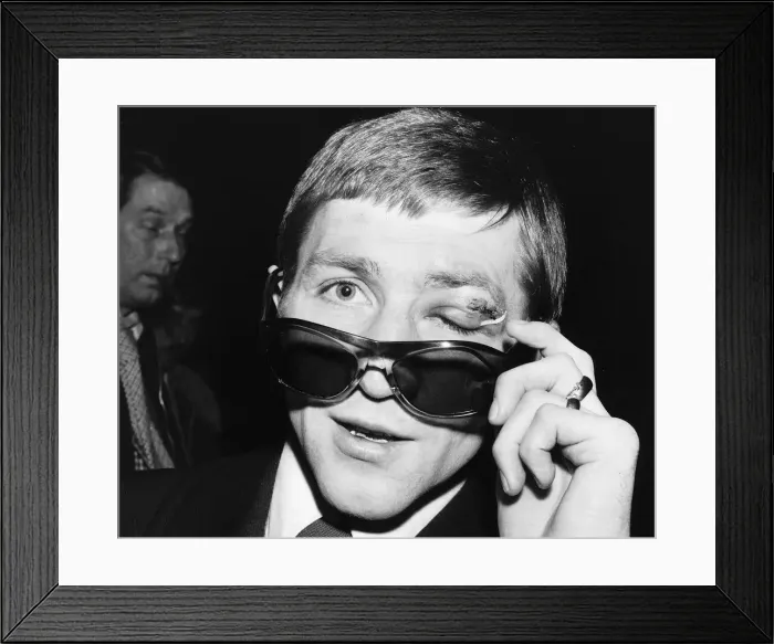 Framed Print : Ken Buchanan former world lightweight boxer at Heathrow. December 1974 Framed Print : Ken Buchanan former world lightweight boxer at Heathrow. December 1974