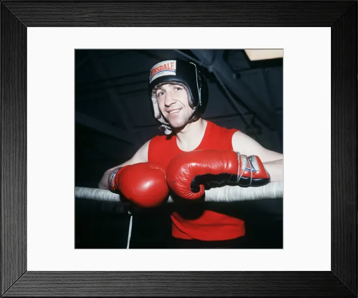 Framed Print : Ken Buchanan boxer 1979 in training gear gloves head protection lwaning on ropes