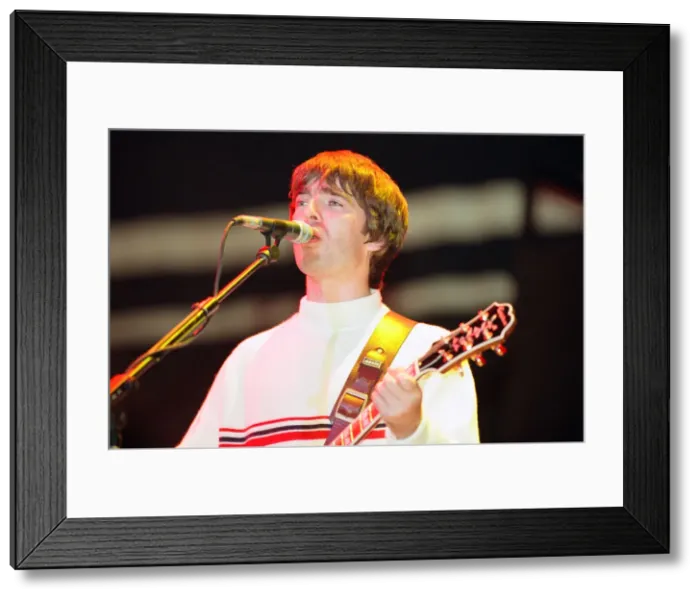 Framed Print : Oasis in concert at Knebworth, Hertfordshire. Noel Gallagher. 11th August 1996 Framed Print : Oasis in concert at Knebworth, Hertfordshire. Noel Gallagher. 11th August 1996