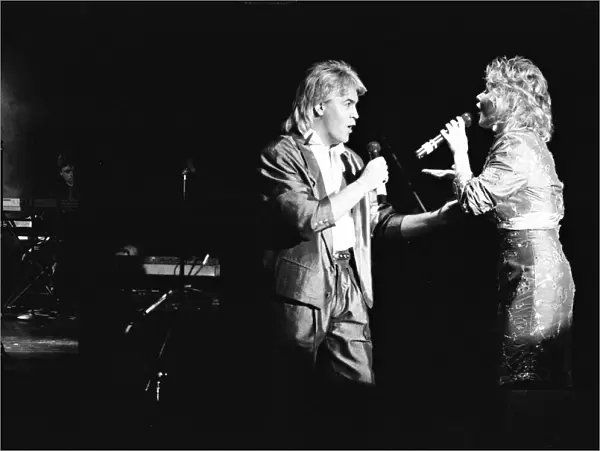 Mike Nolan and Cheryl Baker of Bucks Fizz seen here performing on stage at Leas Cliff
