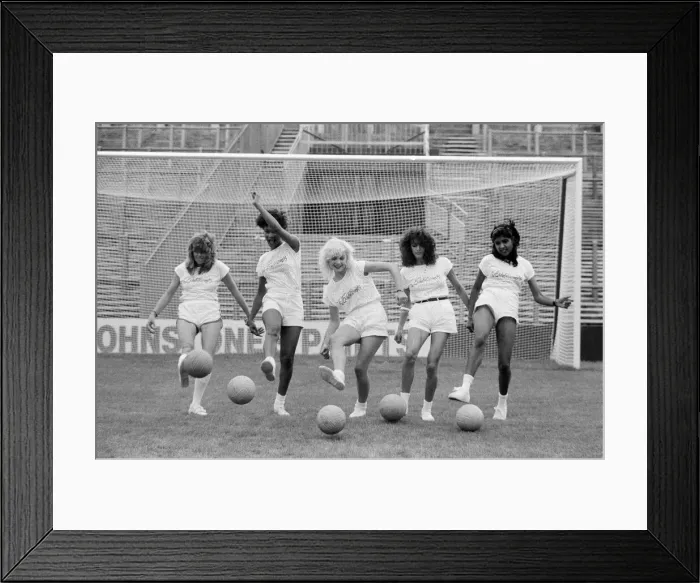 Framed Print : A group of model girls, known as The Exhibitionists, are training for a 5-a-side football