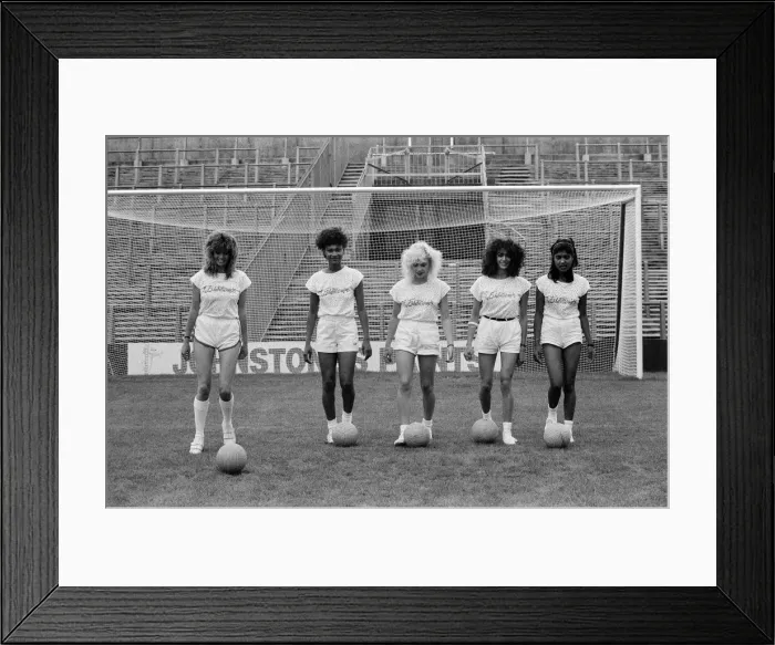 Framed Print : A group of model girls, known as The Exhibitionists, are training for a 5-a-side football
